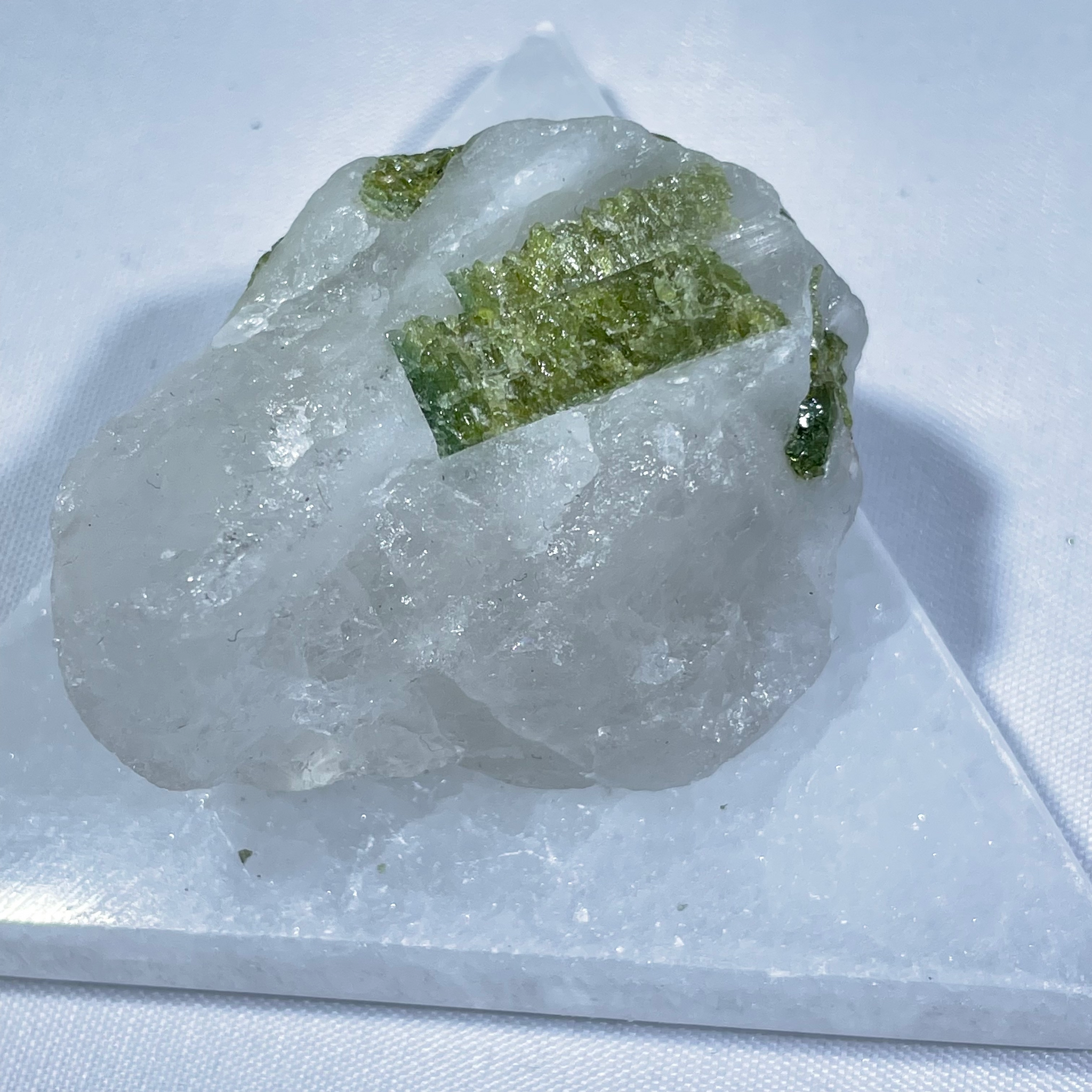 Quartz with 2025 green inclusions